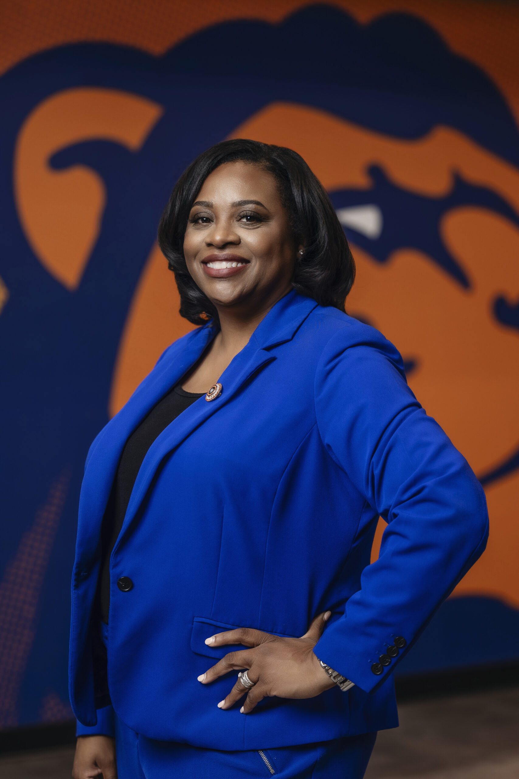Dr. Jackson stands with her hand on her hip