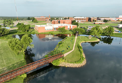 Photo of campus near ponds by bridge