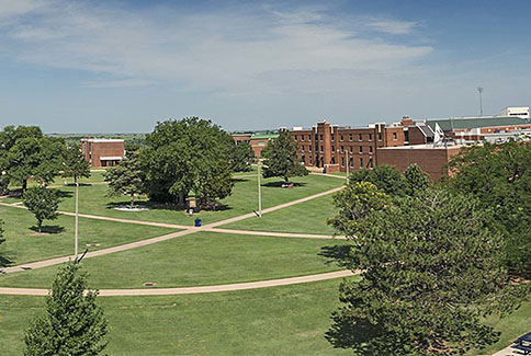 Photo of interior grounds of Langston campus showing trees and campus buildings