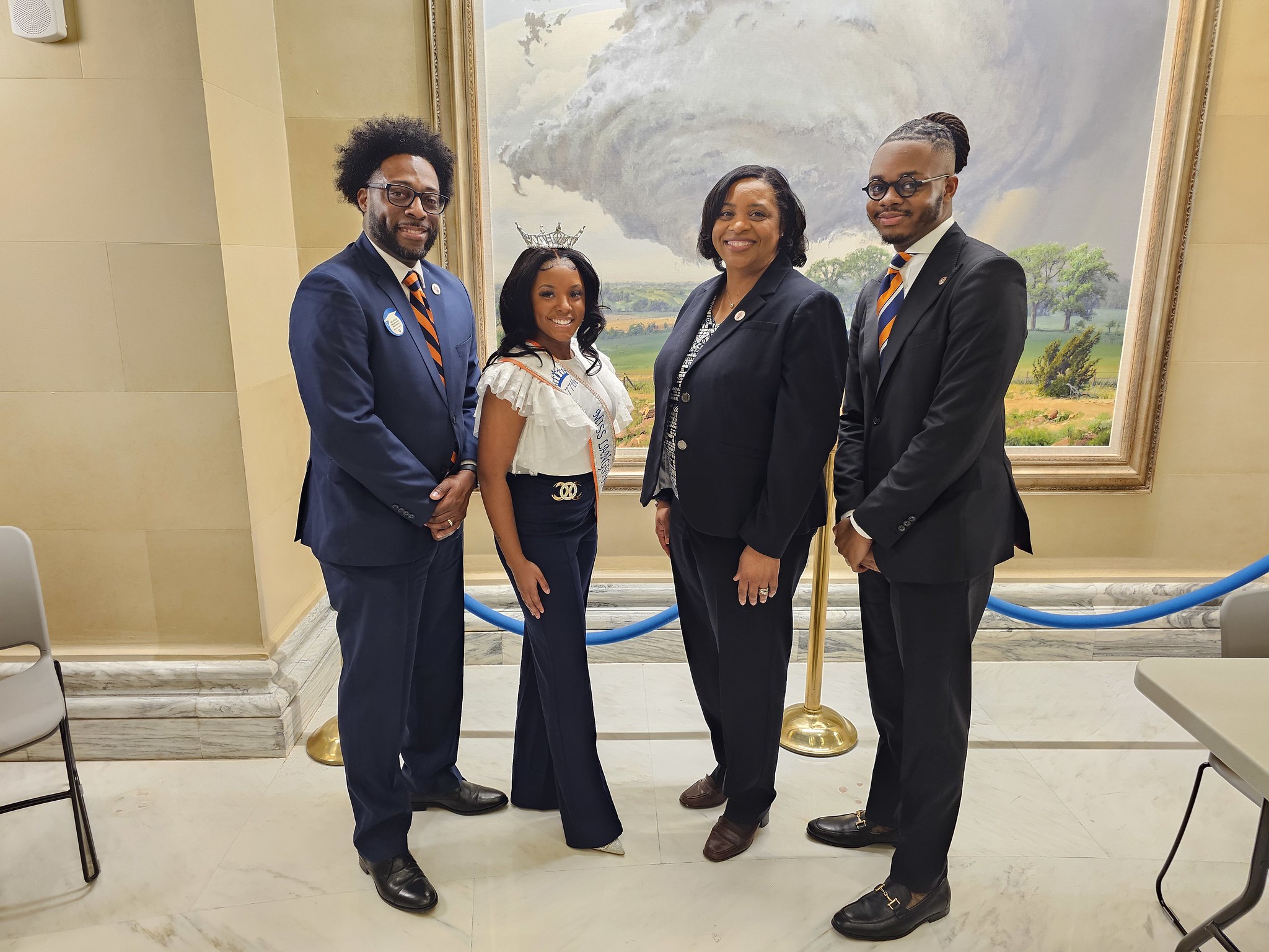 Photo taken at Oklahoma State Capitol with from left Dean of Students Joshua Busby, Miss Langston University, President Ruth Ray Jackson and Mister Langston University