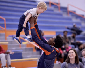 Cortez Mosley lifts up Reece Wright after a game at C.F. Gayles Field House at Langston University