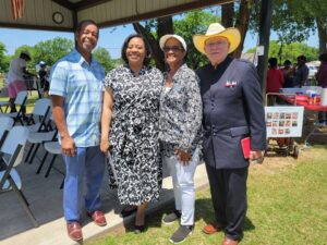 Rev. Everett Mack, Sr., Dr. Ruth Ray Jackson, MaeOma Williams, and Rev. Hersey Hammons pose together for a photo.