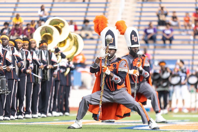 The LU Marching Pride Band performing on the football field