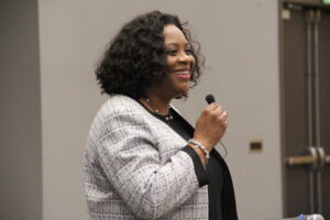 President Ruth Ray Jackson holding a microphone, speaking.