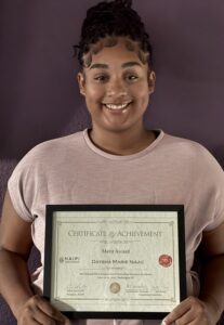 Isaac poses with her award