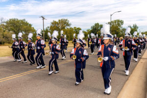 Marching Pride members march in uniform