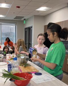 4-H members prepare green beans at the Langston University Horticulture Education and Research Center