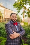 Dr. Jonathon Allen poses in front of I.W. Young Auditorium