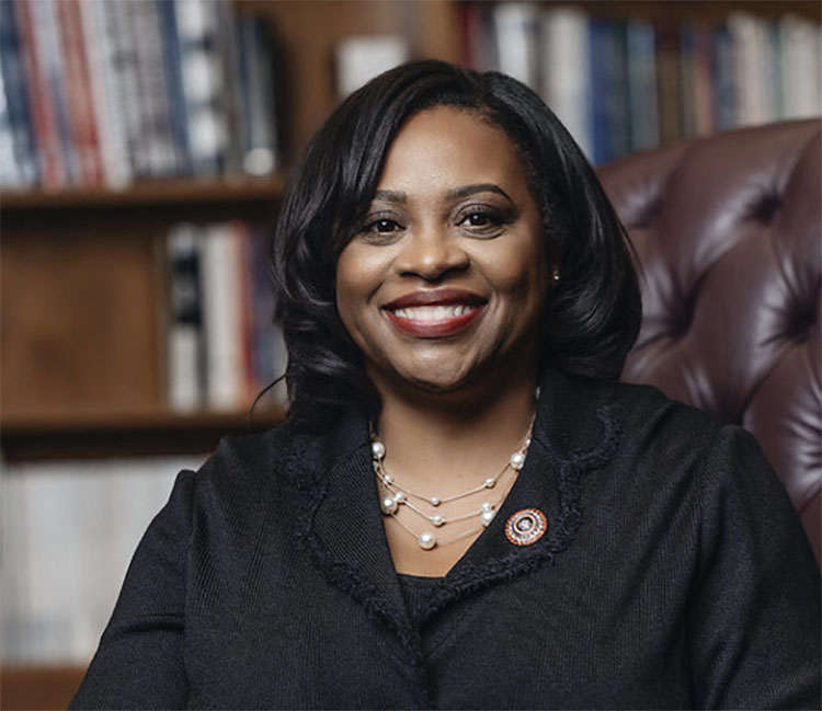 LU President Ruth Ray Jackson seated in office with bookshelf in background