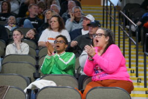Renee James cheers during a basketball game