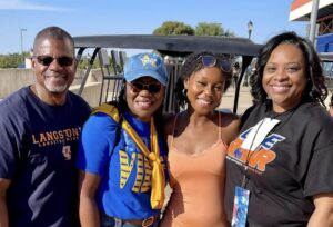 Brianna Campbell and her family pose with President Ruth Ray Jackson.