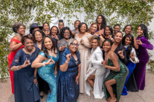A group of AKA alumni pose for a group photo