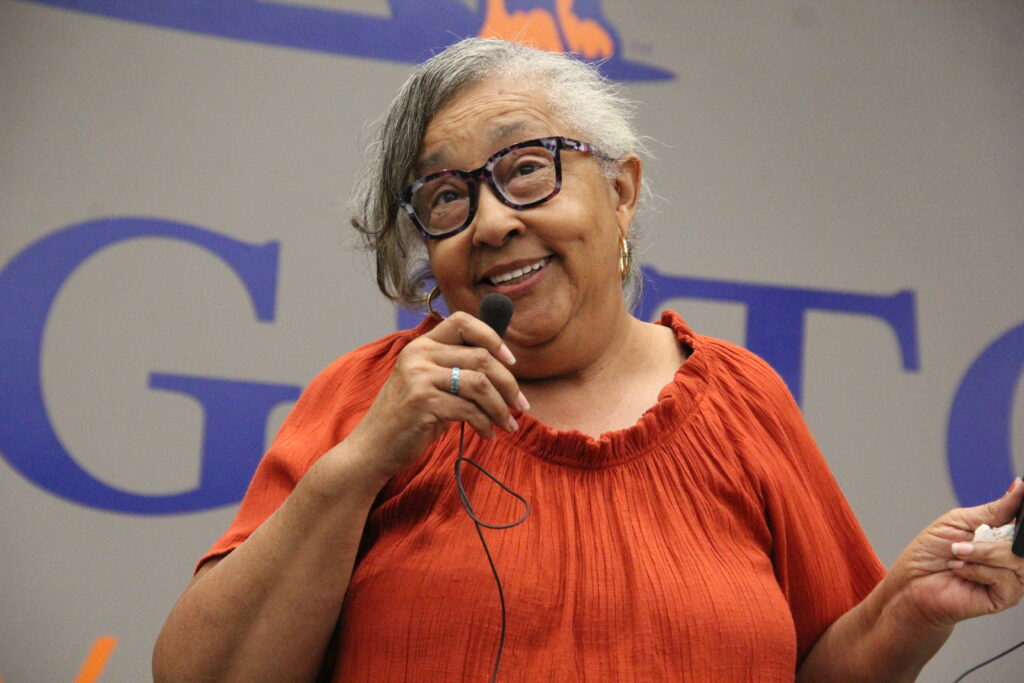 Dr. Emily Patterson Harris speaks into a microphone