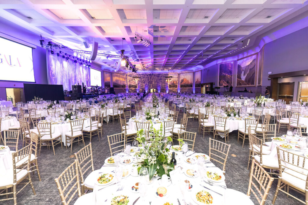 tables set with decorative place settings for the 19th Annual President's Scholarship Gala