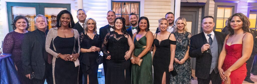 a group pf people in formal attire