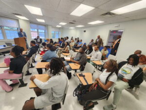 Business students sit at desks