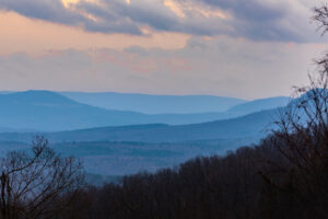 Fog and shadows creating color gradients of the Arkansas Ozark Mountains at Sunrise.