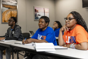 students sitting at desks with notebooks open at the LU-OKC campus