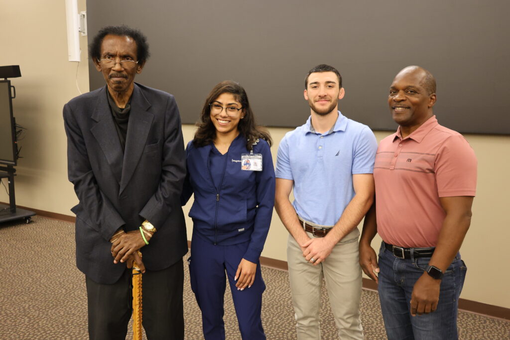 Dr. Oscar Battle, Jazmeen Sarkissian, and Parker Avendano pose for a photo