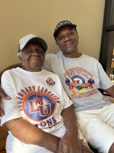 Ozetta Parker and her son, Zach, sit on a bench together