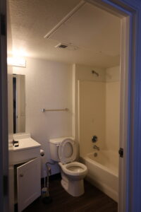 interior of a Centennial Court Apartments bathroom before renovation