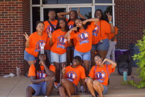 group of student ambassadors pose for a silly photo