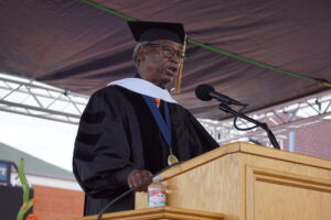 Sherman Lewis speaking at Commencement.