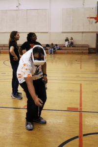 a student moves around while wearing a V R headset