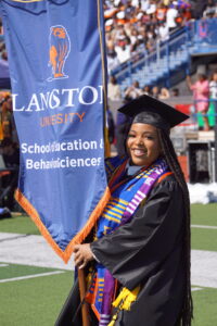 Brooklyn Noiel in graduation regalia