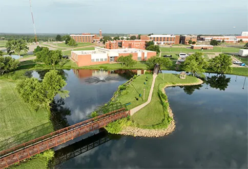 Photo of campus near ponds by bridge